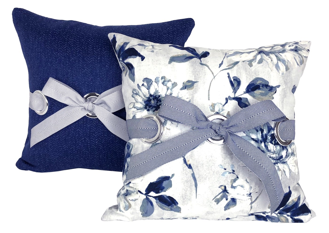 Closeup of completed blue-white grommet cushions with blue-white chevron ribbons