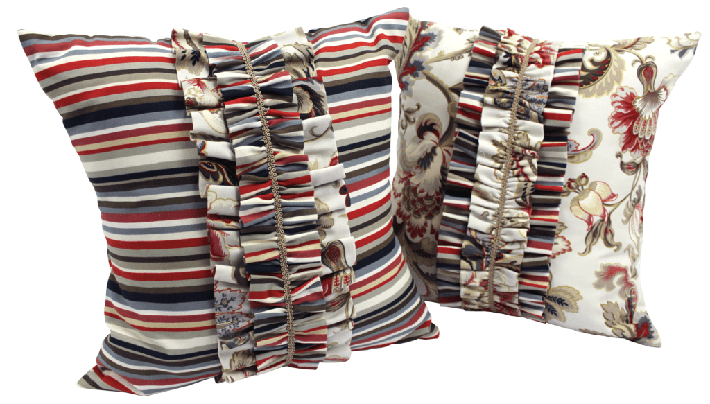 Closeup of two stripped multicolour ruffle cushions
